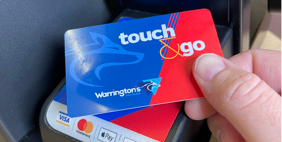 Image of a hand using a touch and go smartcard